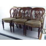 A set of six mid Victorian mahogany framed, pierced splat back balloon dining chairs,