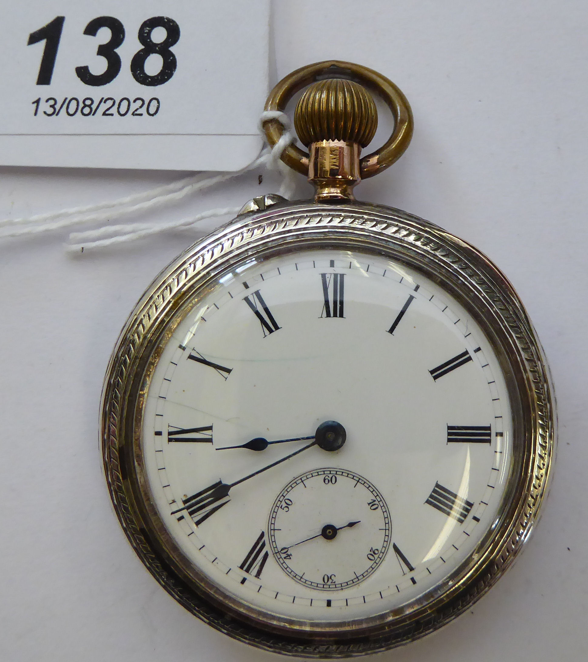 A silver coloured metal cased, open faced, pocket watch,