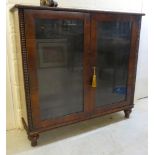 A Regency rosewood dwarf cabinet bookcase with bead carved borders, the pair of full height,