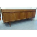 A 1970/80s Austin teak sideboard with four frieze drawers,