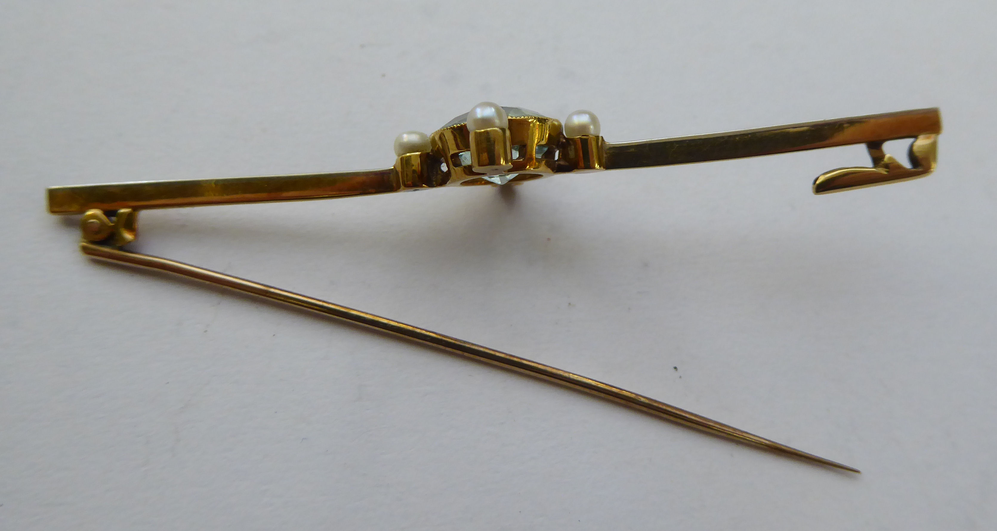 A gold coloured metal bar brooch, - Image 2 of 2