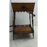 A late Victorian walnut work box of tapered form with a pair of rising flaps and a folding