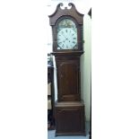 An early 19thC oak and mahogany longcase clock, the hood with a swan neck pediment,