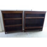 Two similar late Victorian mahogany open front, two tier bookcases,