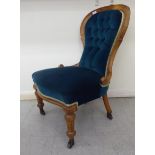 A late Victorian mahogany framed salon chair,