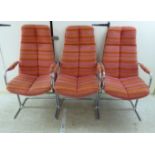 A set of three 1960s Pieff Furniture chromium plated steel dining chairs with orange and pink