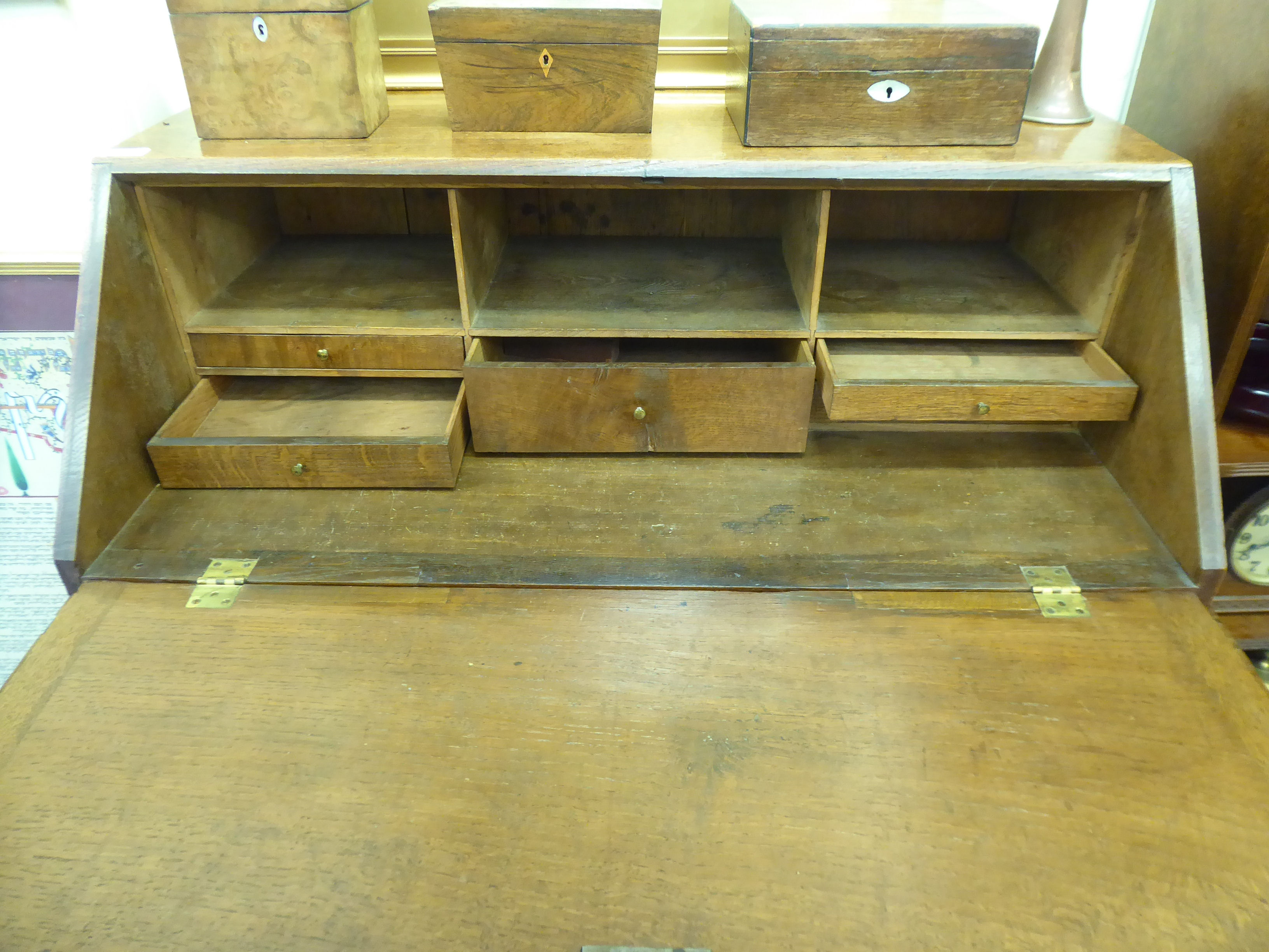 A George III oak bureau, the fall flap over three graduated drawers, - Image 3 of 4