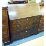 An early 19thC mahogany bureau, the fall flap enclosing a fitted interior,