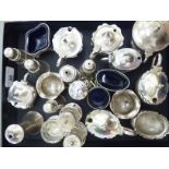 A miscellaneous collection of silver condiments receptacles, some on loaded bases,