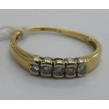 An 18ct gold five stone diamond ring 11