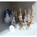 Fourteen blown and moulded glass scent bottles of varying designs 5''-8''h OS6