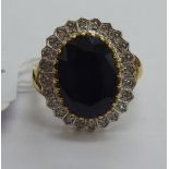 A 9ct gold diamond and sapphire cluster ring 11