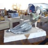 A 1930s Art Deco patinated spelter figure, a Dutch girl,