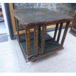 A late 19thC tooled and gilded, green hide covered, rotating table-top bookstand,