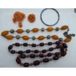 Jewellery: to include an amber coloured bead necklace 11