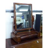 A mid Victorian mahogany framed toilet mirror, the bevelled rectangular plate,