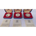 Three Elizabeth II silver proof crowns,