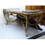 An early 20thC Louis XV kingwood and marquetry coffee table, the top with a metal gallery,