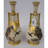 A pair of early 20thC Worcester gilded, satin glazed china twin handled, narrow neck,