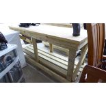 A modern pine two tier work bench of planked and slatted construction,
