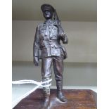 An early 20thC cast and patinated bronze figure,