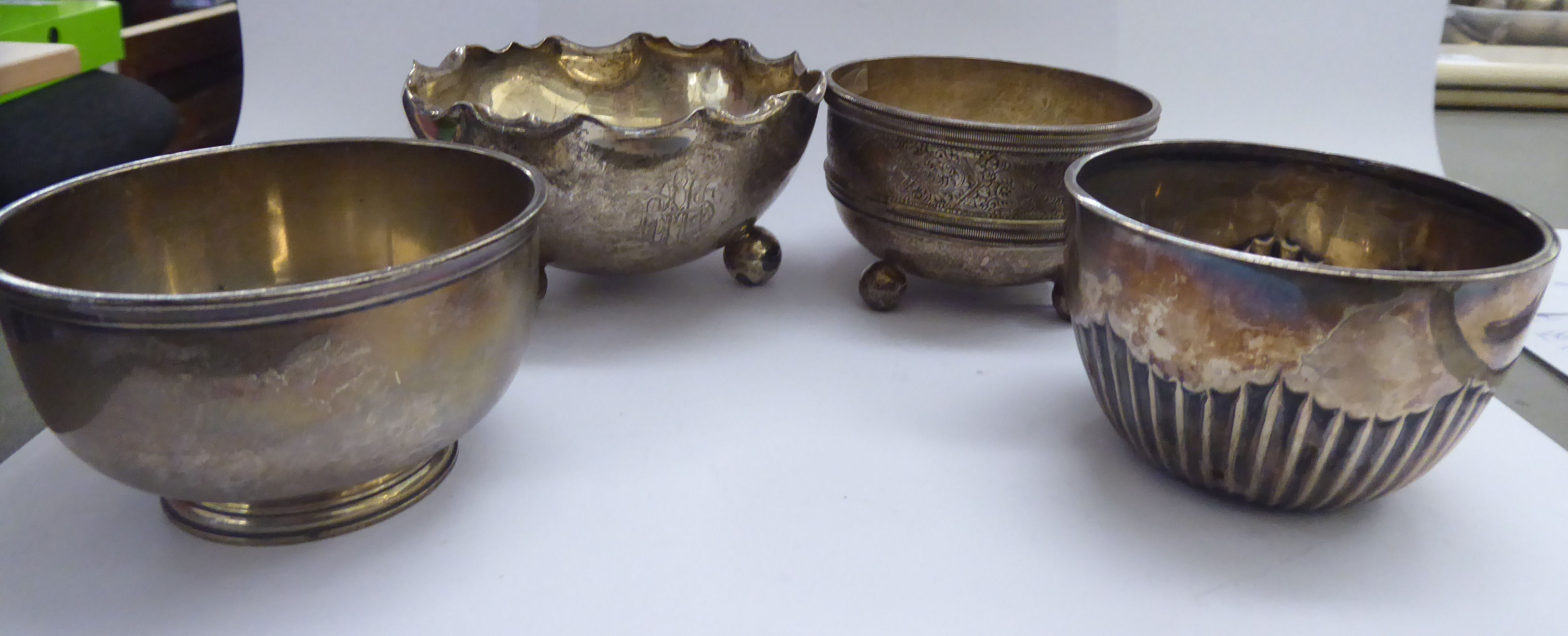 Four small silver bowls, viz. one demi-reeded 3.25''dia; another plain, footed 3.