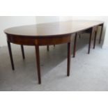 A George III crossbanded mahogany drop leaf dining table,