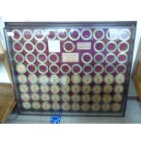 A framed and glazed display of brass beer barrel bushes 25'' x 31'' BSR