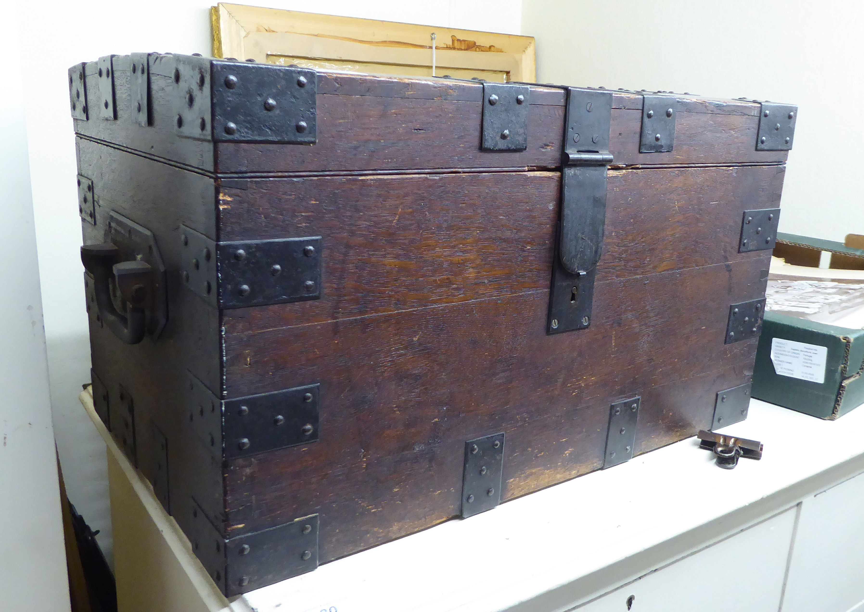 A late 19thC oak silver chest with rivetted,