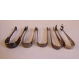 Four pairs of late 18th and 19thC silver sugar tongs;