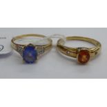 Two 9ct gold rings, one set with an amber coloured stone,