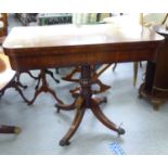 A Regency mahogany foldover card table, the rotating top enclosing a green baize lined interior,