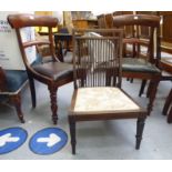 A pair of early Victorian mahogany framed, curved bar back dining chairs,