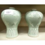 A pair of 20thC Chinese celadon glazed porcelain vases of tapered, waisted, baluster form,