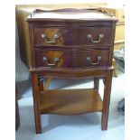 A modern mahogany finished, serpentine front bedside cabinet with a galleried top,