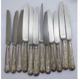 A set of six stainless steel table knives,