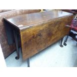An early 19thC mahogany drop leaf gateleg dining table, the top with square corners,