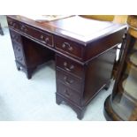 A modern mahogany finished, nine drawer, twin pedestal desk,