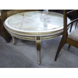 A modern French style, cream painted, gilded and carved table with a marble top,