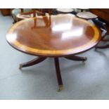 A modern mahogany finished coffee table with a wide, crossbanded, satinwood border and reeded edge,