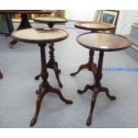 Four similar 20thC wine tables, two with inset hide covered surfaces,