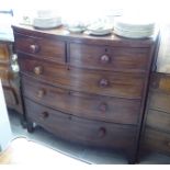 An early 19thC mahogany bow front dressing chest,