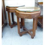 A pair of mid 20thC teak occasional tables with crossbanded tops, raised on a splayed underframe,