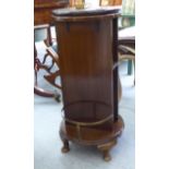 An early 20thC stained mahogany library pedestal with brass fittings,