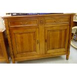 A modern French mahogany finished sideboard, comprising two inline drawers,