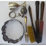 Silver items: to include a pressed and pierced decorative mount; and a pair of oval,