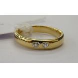 An 18ct gold band ring,