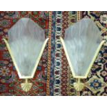 A pair of mid 20thC French wall lights, the moulded, frosted glass shades stamped Deguz,