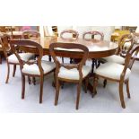 An Edwardian satinwood inlaid mahogany dining table, the top with D-shaped ends,
