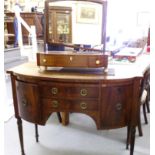 A William IV mahogany bow front dresser, comprising two short drawers, flanked by two curved,